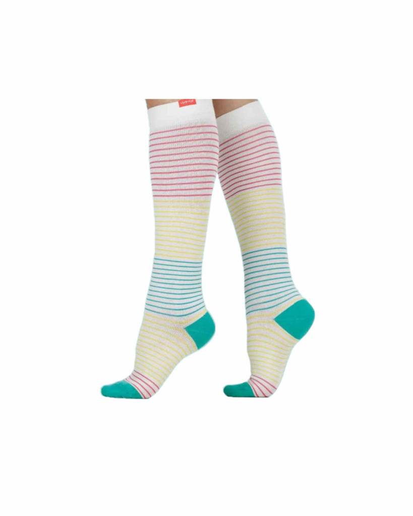 A pair of knee-high socks with horizontal stripes in shades of pink, cream, and blue, with teal toes and heels.