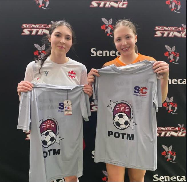 Two female soccer players holding 'Player of the Match' (POTM) shirts at a Seneca Sting event, featuring FFS and SkipperChoice branding