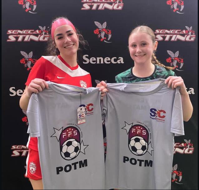 Two female soccer players holding 'Player of the Match' (POTM) shirts at a Seneca Sting event, featuring FFS and SkipperChoice branding