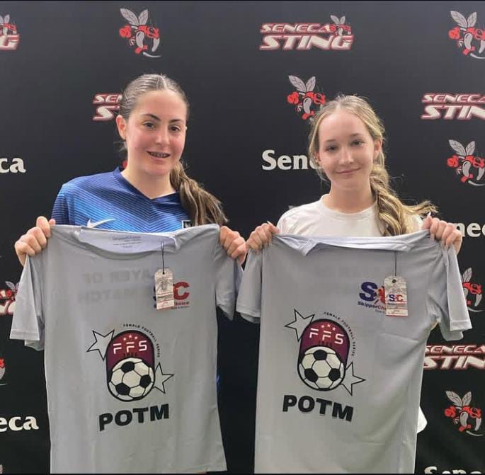 Two female soccer players holding 'Player of the Match' (POTM) shirts at a Seneca Sting event, featuring FFS and SkipperChoice branding